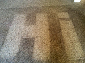 Heavily stained rental property carpet before professional cleaning in Cache Valley Utah