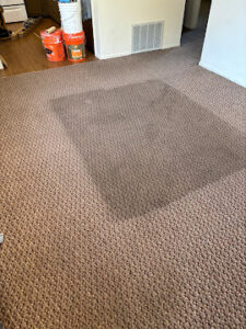 Carpet cleaning equipment and extraction wands set up on rental property carpet in Cache Valley Utah